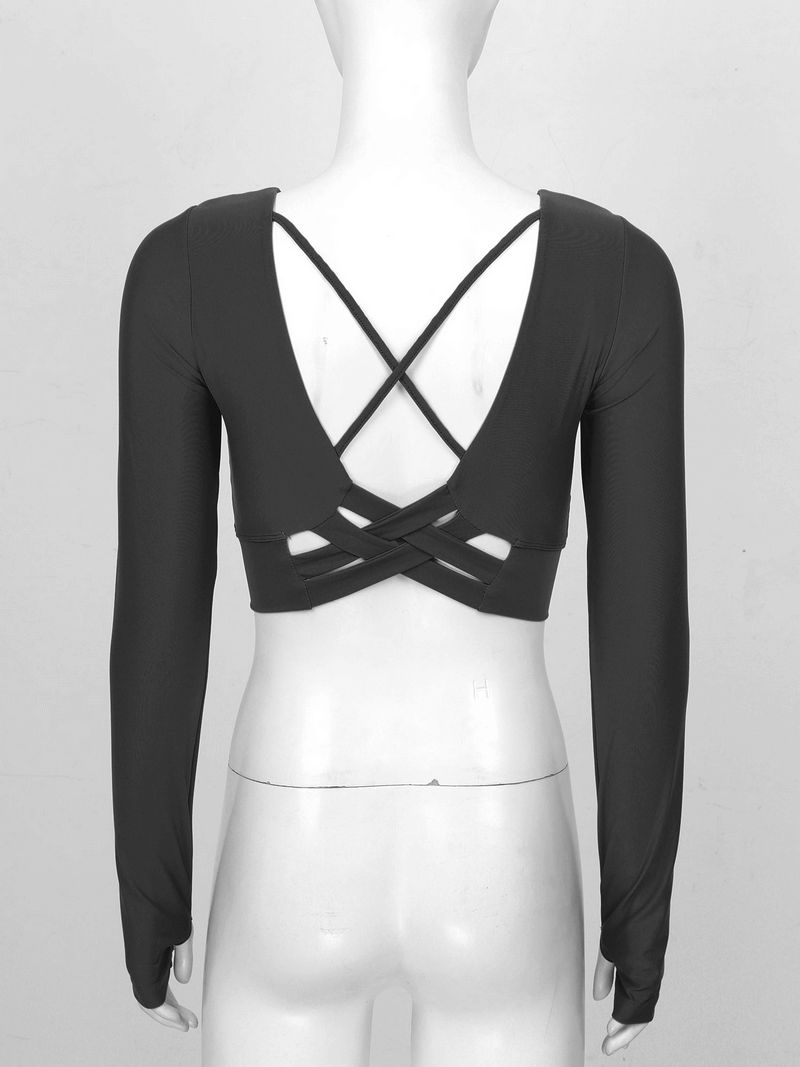 Back view of a black sports seamless long sleeves cropped top with cross strappy design, perfect for activewear fashion.